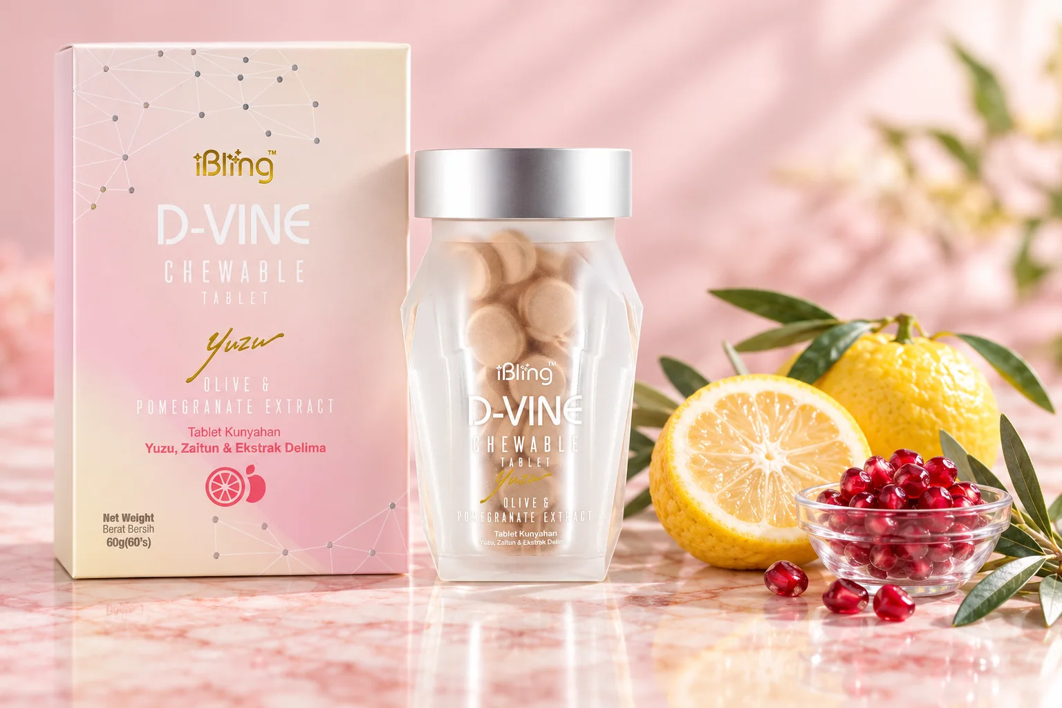 The D-VINE box and jar on pink marble with a halved yuzu, pomegranate seeds and olive leaves