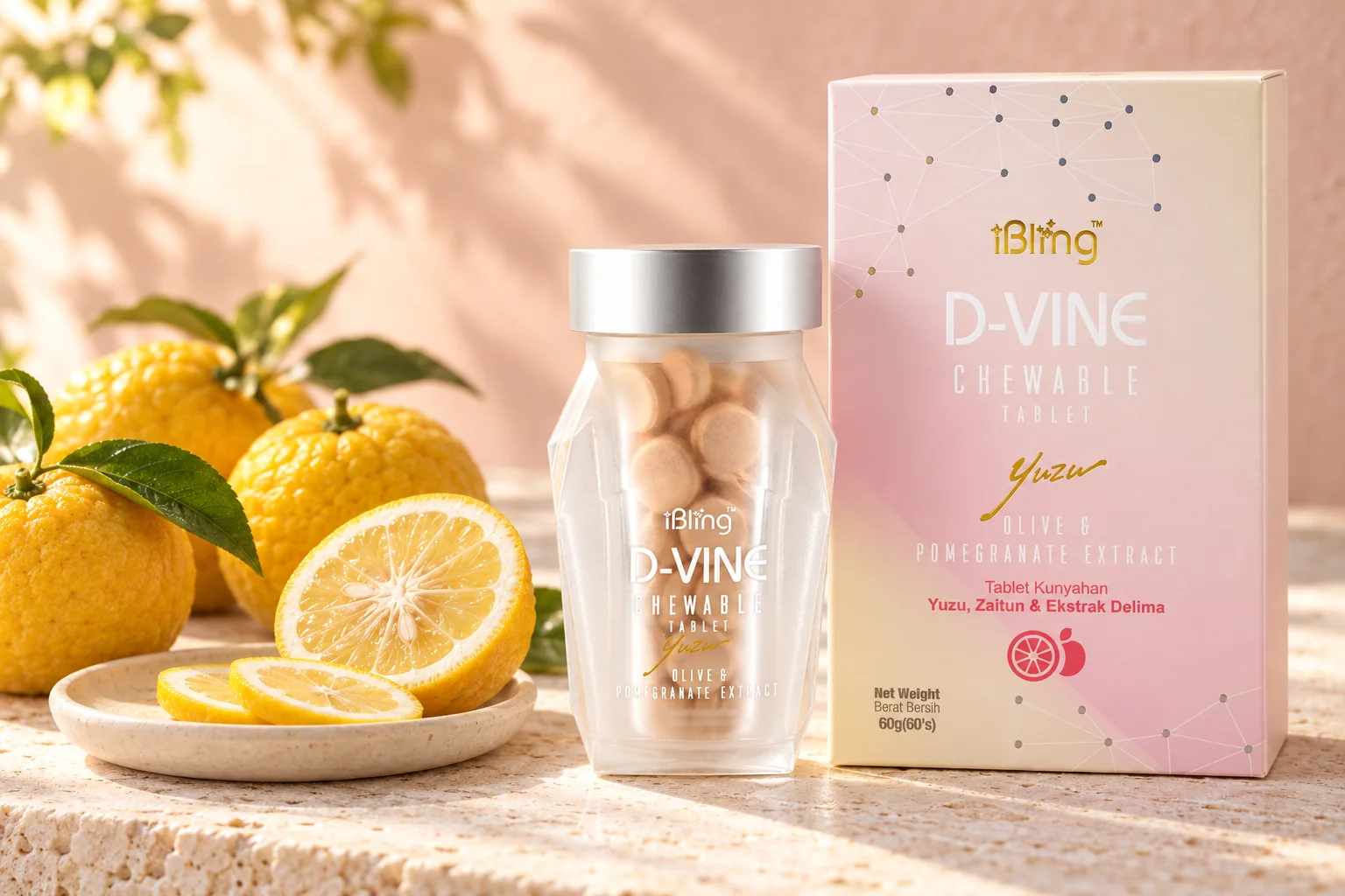 A D-VINE box and jar of chewable tablets beside whole and halved yuzu with green leaves