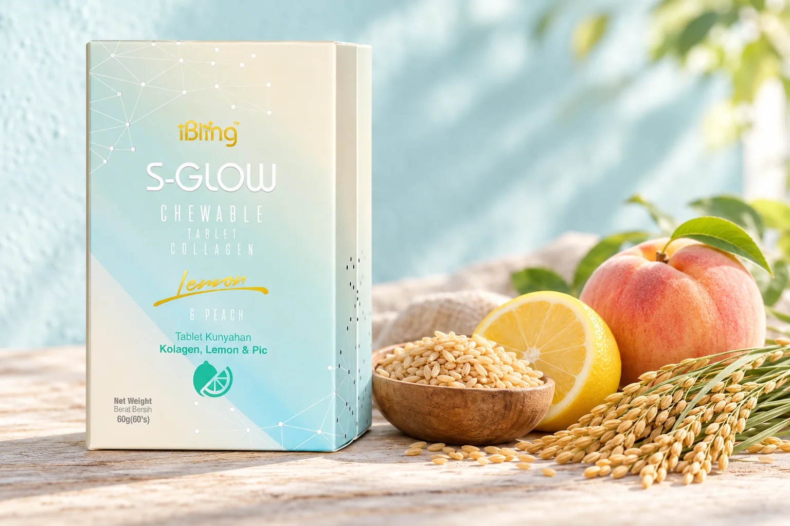 An S-GLOW box beside a bowl of rice grains, rice stalks, a halved lemon and a peach on pale wood