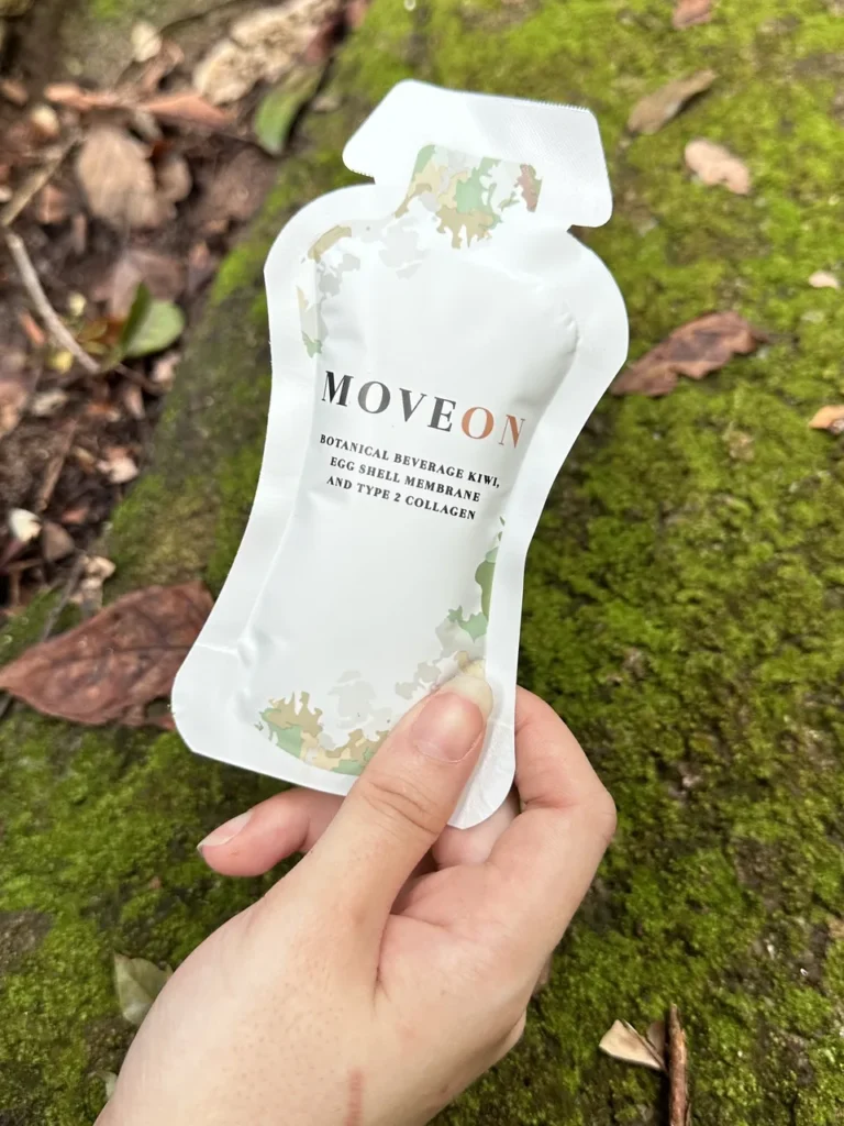 MOVEON sachet held up on a jungle trail