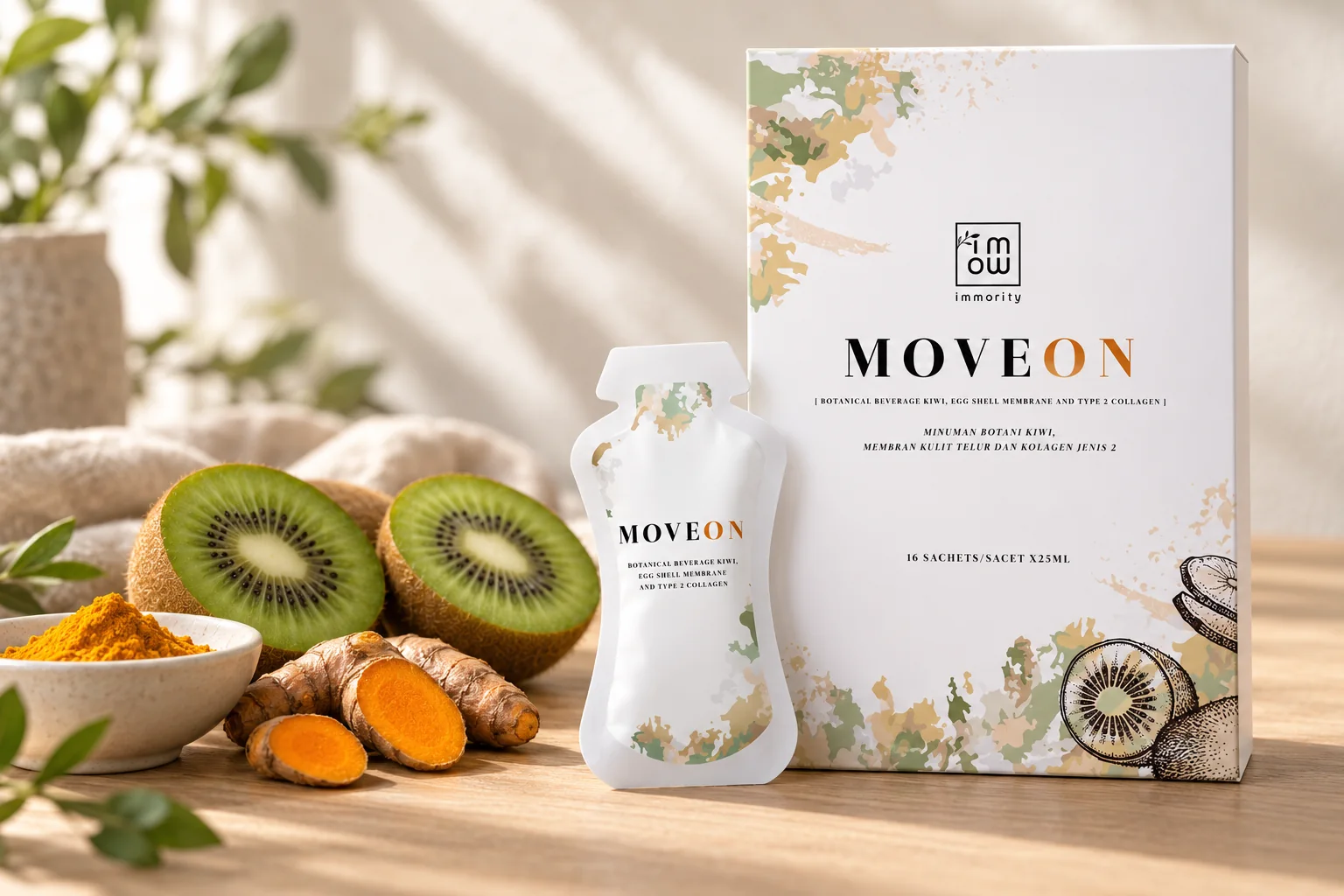 The MOVEON box and sachet with halved kiwis, fresh turmeric roots and a dish of turmeric powder