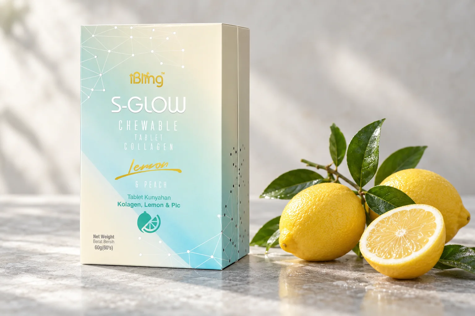 The S-GLOW box with a fresh lemon branch and a halved lemon on grey stone