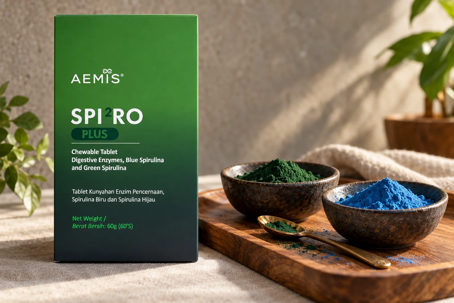 The SPIRO Plus box with bowls of green and blue spirulina powder on a teak tray