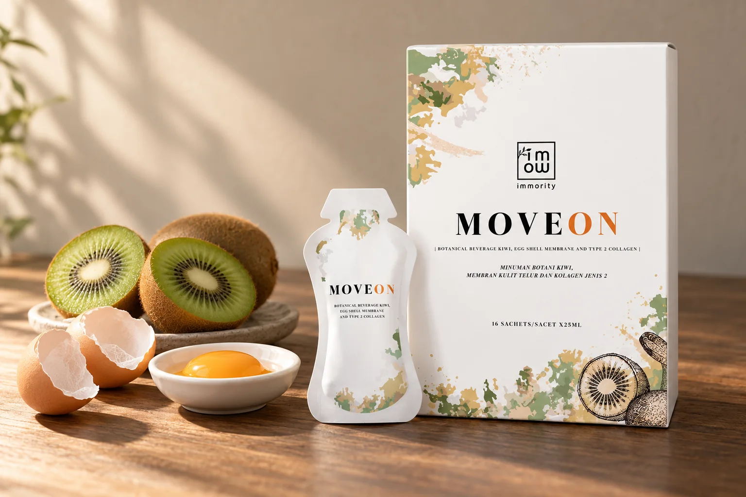 The MOVEON box and sachet with a cracked egg, an egg yolk and halved kiwis on a dark wooden table