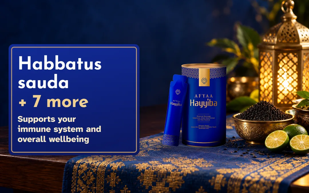 The AFYAA Hayyiba tin and a sachet on a royal-blue plinth with a dish of black seeds and calamansi. Habbatus sauda + 7 more. Supports your immune system and overall wellbeing.