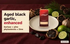 Aged black garlic cut open to show the black cloves, limes and pine beside the Sahiyya+ tin. Aged black garlic, enhanced. Garlzac aged black garlic, pine phytosterols and lime.