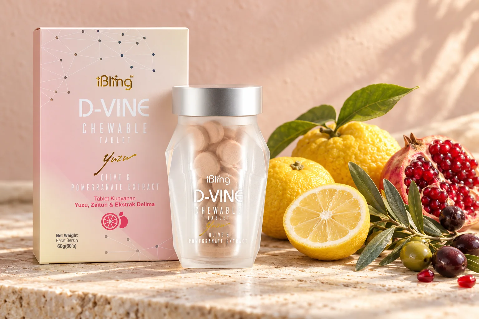 The D-VINE box and jar beside yuzu, a broken-open pomegranate and an olive sprig on pale stone