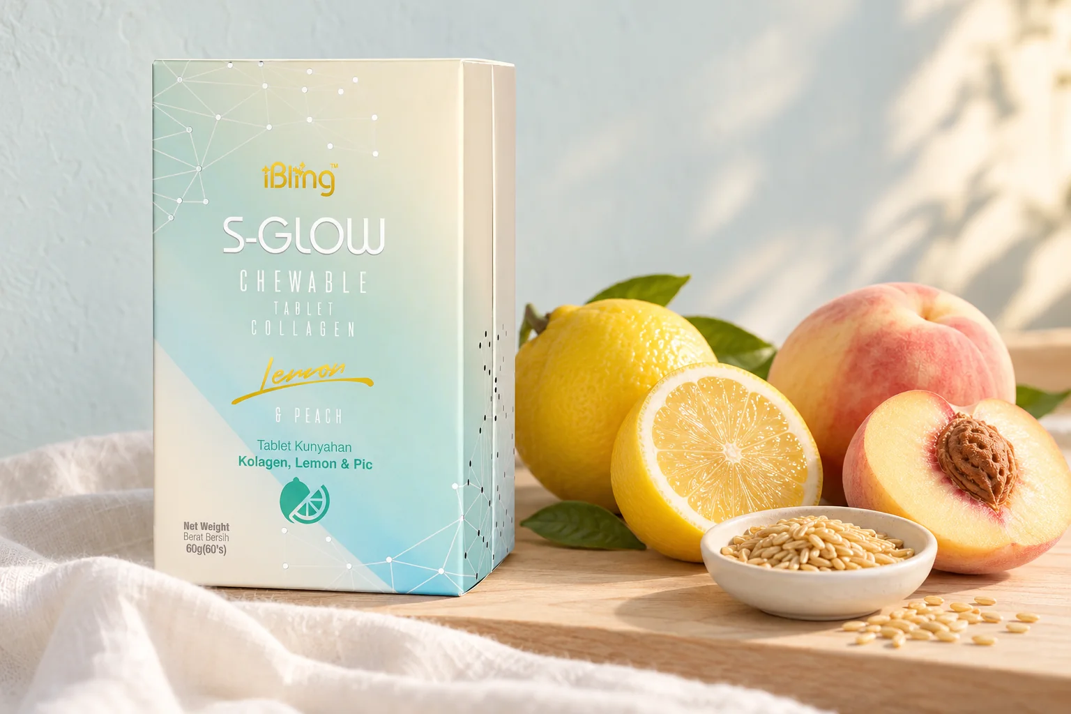 The S-GLOW collagen chewable box beside lemons, a ripe peach and a dish of rice germ