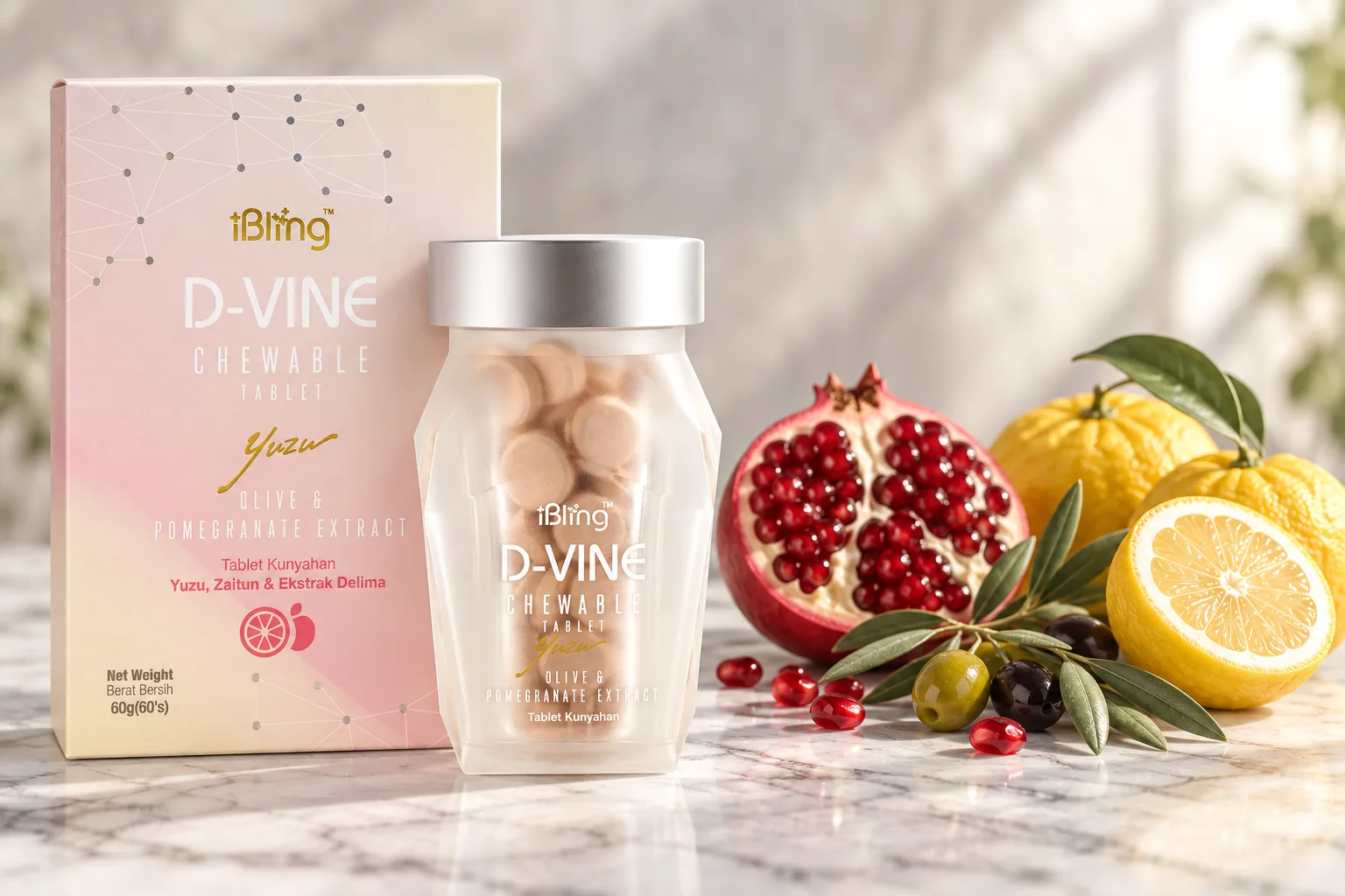 The D-VINE box and jar beside a halved pomegranate, an olive sprig and yuzu on white marble