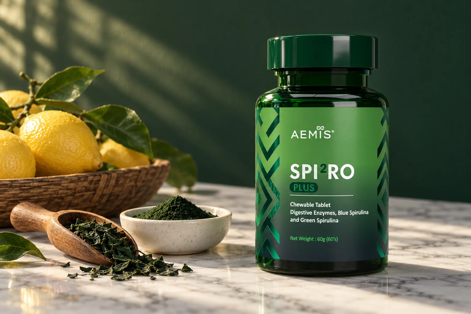 The SPIRO Plus bottle beside whole lemons, dried green spirulina and chlorella powder on white marble