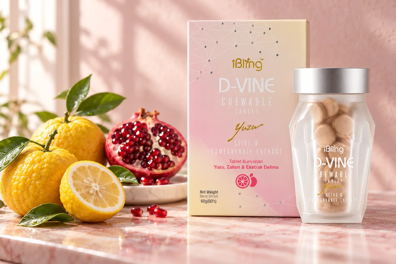The D-VINE box and jar beside whole and halved yuzu and a cut pomegranate on pale marble