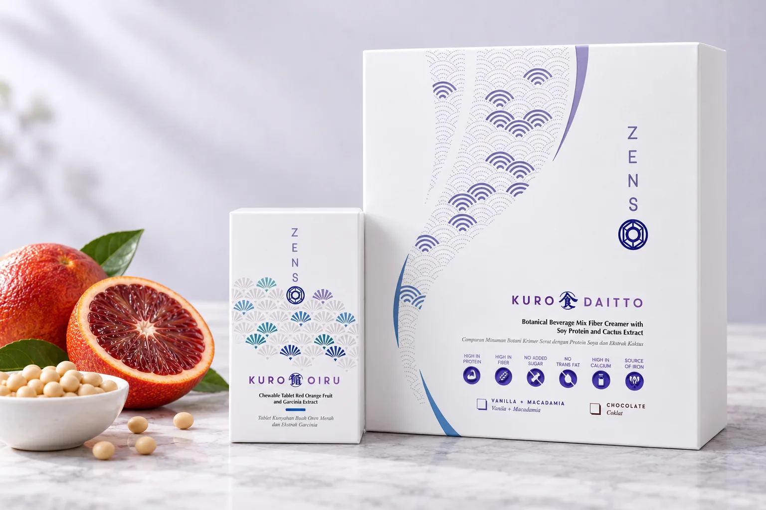 The KURO DAITTO and KURO OIRU boxes from ZENSO Lite with blood oranges and a bowl of soybeans