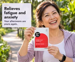 A laughing woman in her fifties after a walk in a Singapore park, holding up a Turning Me sachet: relieves fatigue, your afternoons are yours again.