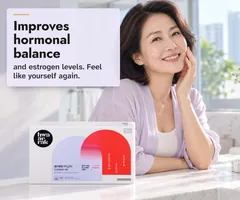 A glowing woman in her fifties at her bathroom mirror in the morning, the Turning Me box on the counter: improves hormonal balance, feel like yourself again.