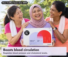 Three women friends in their fifties laughing in a park after a morning walk, one holding the Hwa Ae Rak Turning Me box: boosts blood circulation. Over 5 million boxes since 2003.