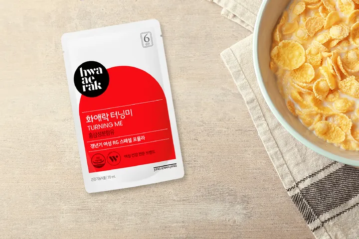 A Hwa Ae Rak Turning Me sachet on the breakfast table beside a bowl of cereal