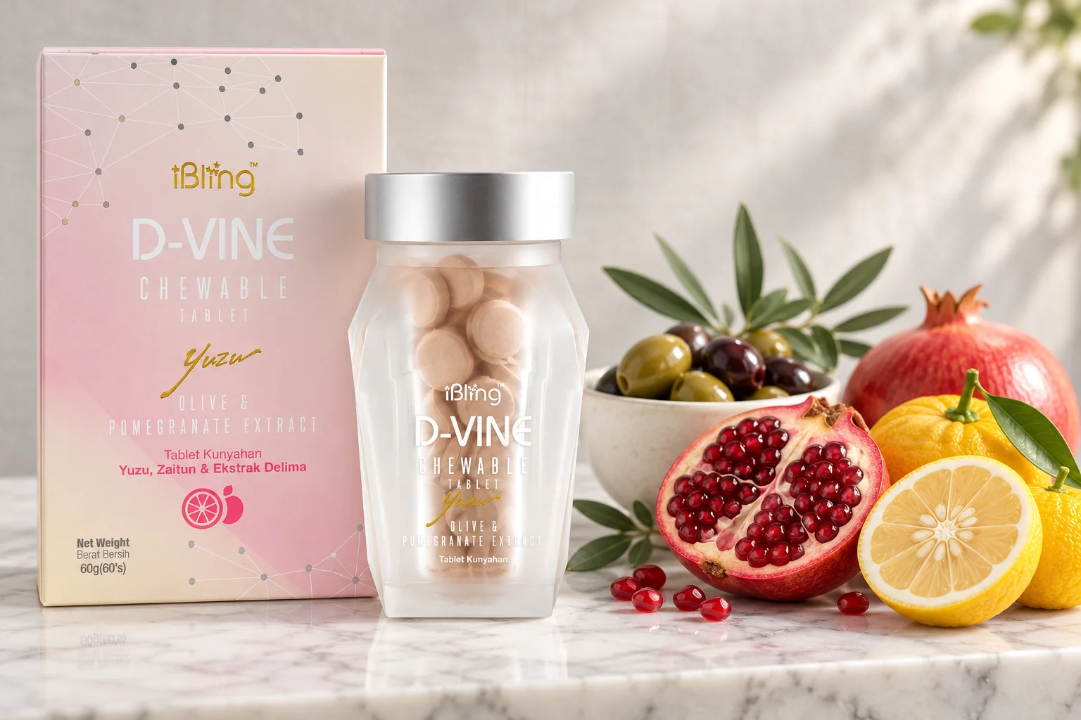 The D-VINE box and jar beside yuzu, a halved pomegranate and an olive branch on white marble