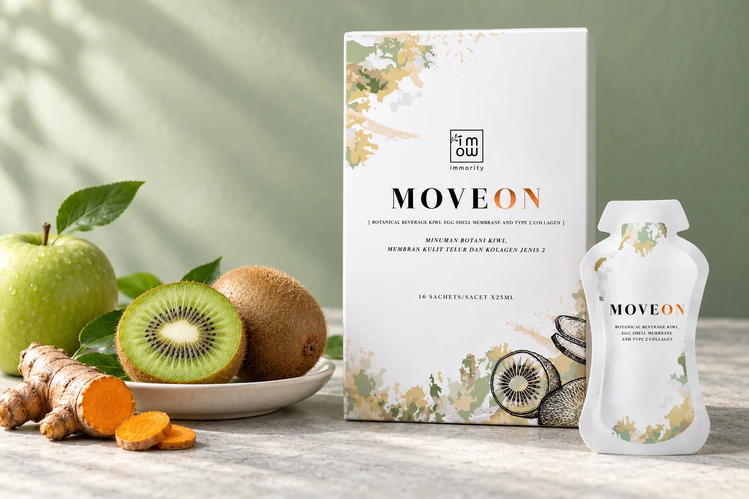 The MOVEON box and a MOVEON sachet beside a halved kiwi, a green apple and a fresh turmeric root